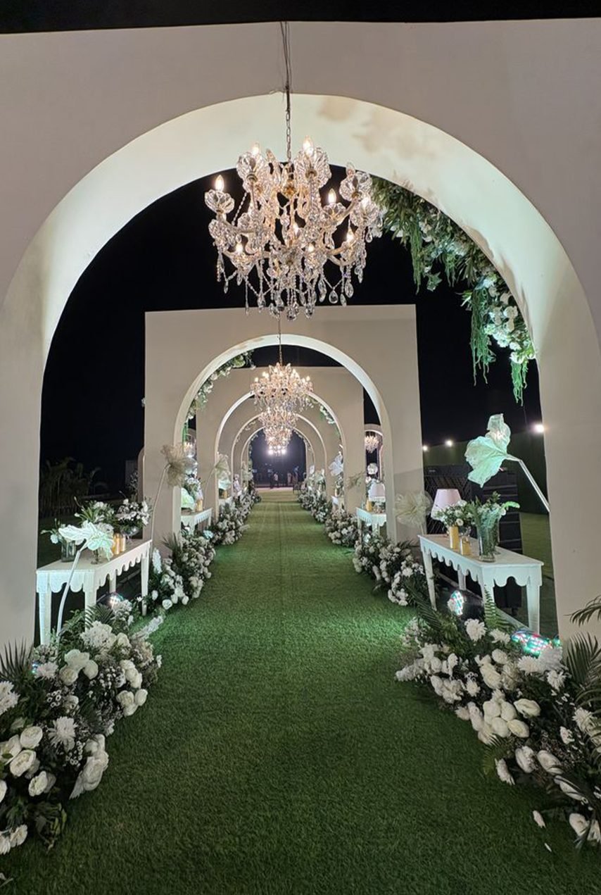 grand reception entrance with warm lights and decorations